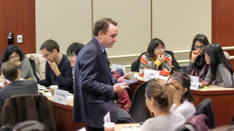 Dan Levy circulating the classroom