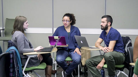 Student group of three conversing