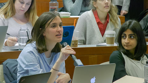 Close up of student with microphone responding to Professor Grotzer.