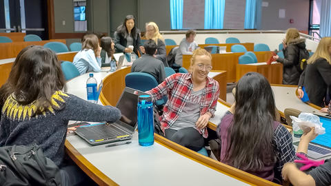 Graduate students in Professor Grotzer's class mingling and smiling.