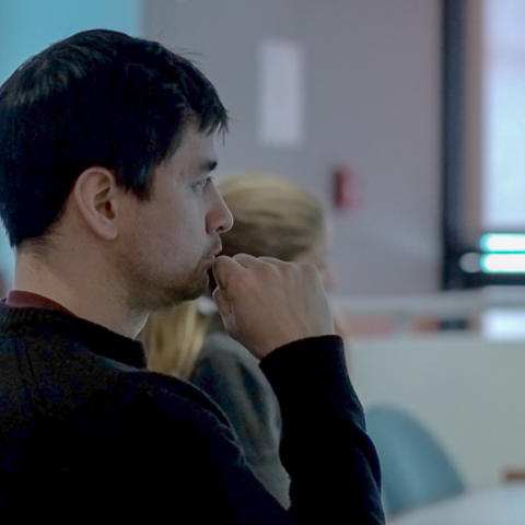 Close up of student watching Professor Grotzer, with hand up at chin.